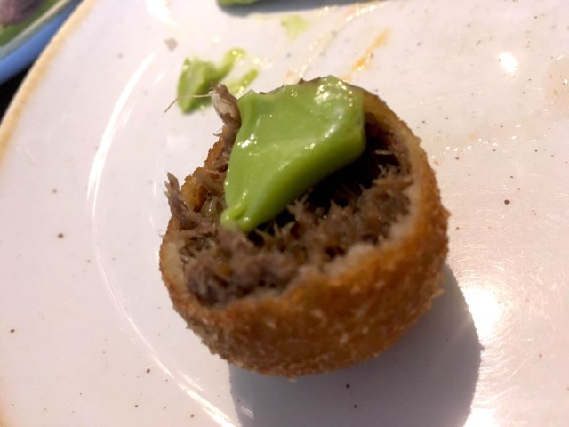 Oxtail croquette with pea and wasabi puree